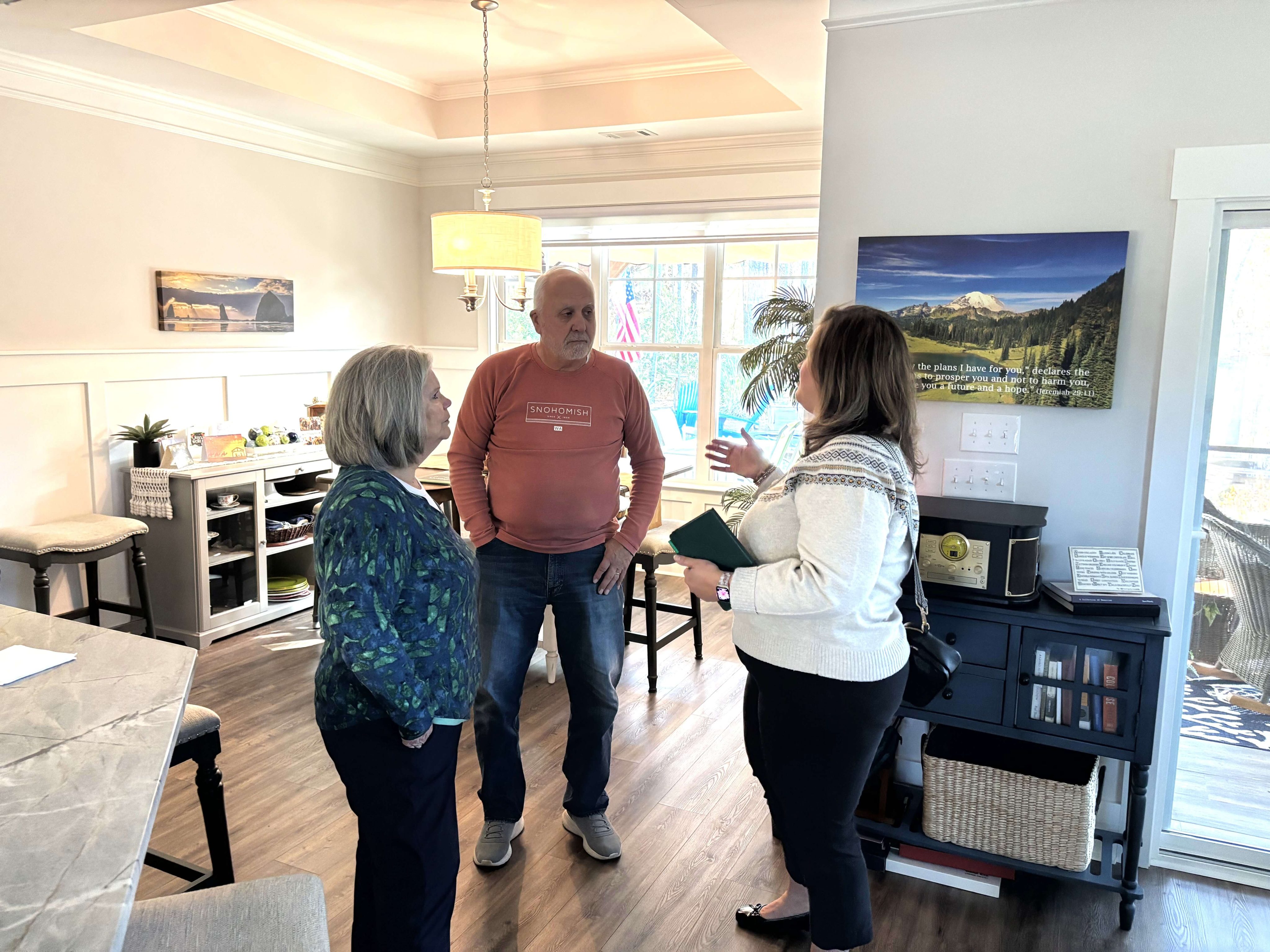 Savannah Lakes Village Realtor Erin Hill meeting with home buyers at a lakefront property