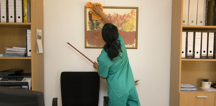 Employee Cleaning Office