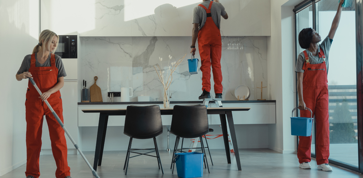 Group of People Cleaning a Dining room