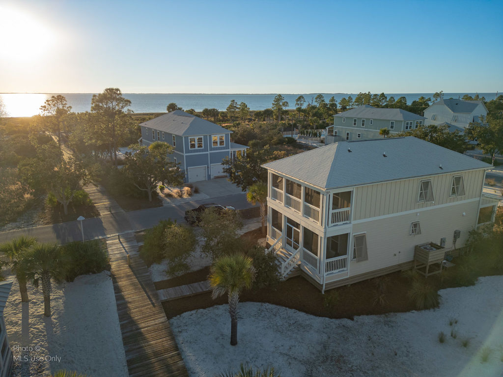 Aerial view of boardwalk and 102 Salt Air Ct