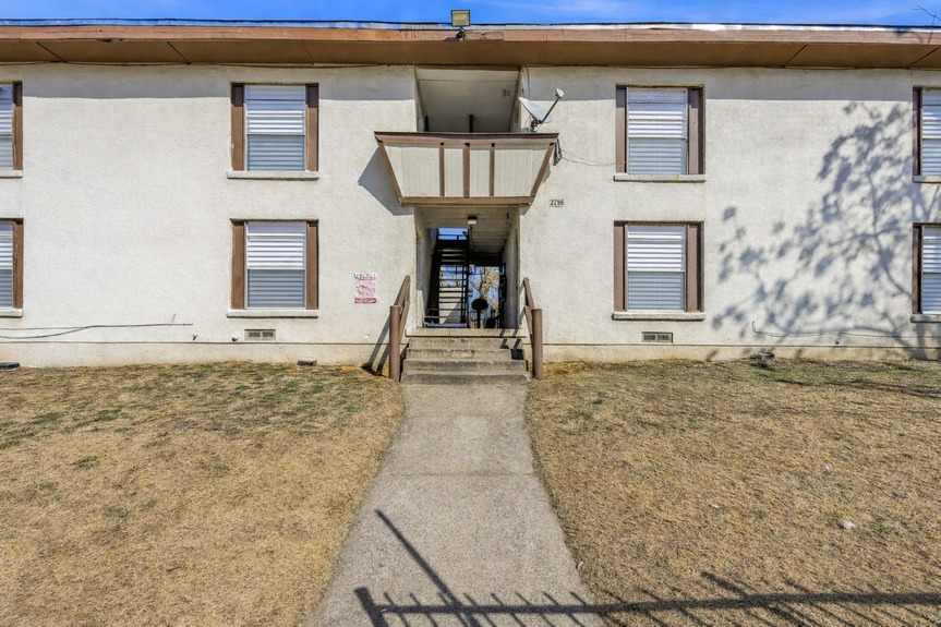 Beige apartment building with walkway