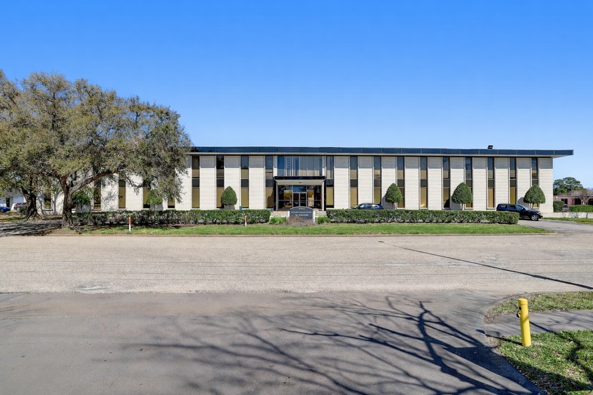 Modernist office building and oak tree