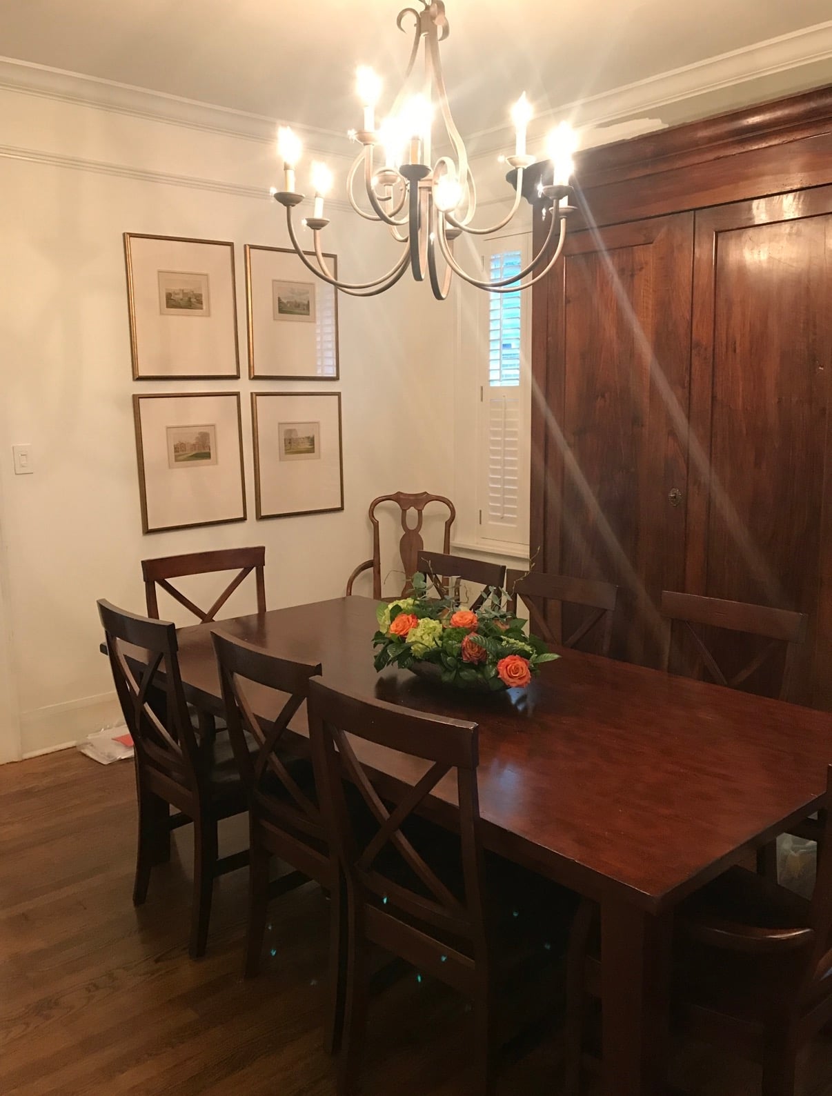 Dining room with original crown molding and hardwood floors in a historic Midtown Columbus home