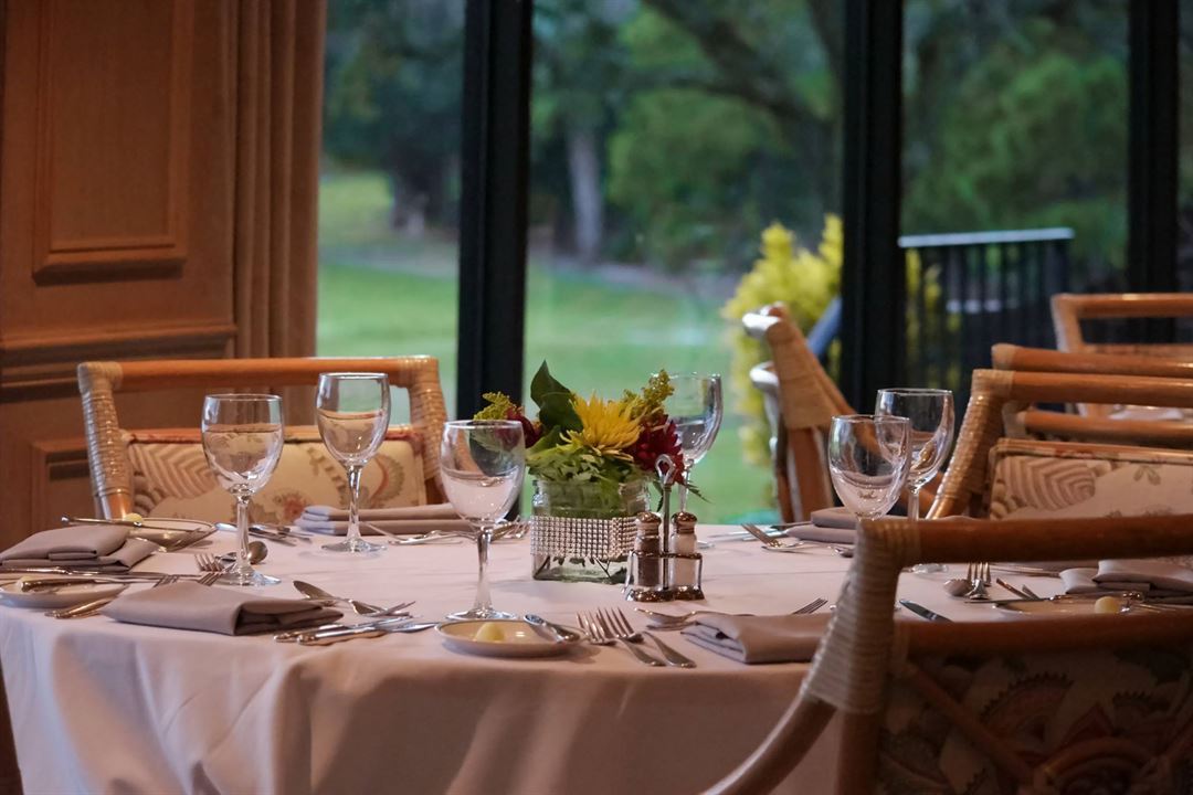 Formal dining room overlooking the golf course at Bent Pine Golf Club