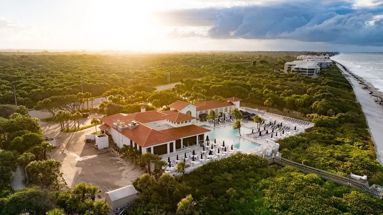 Aerial view of Grand Harbor, its waterways, residences, and golf-course setting in Vero Beach