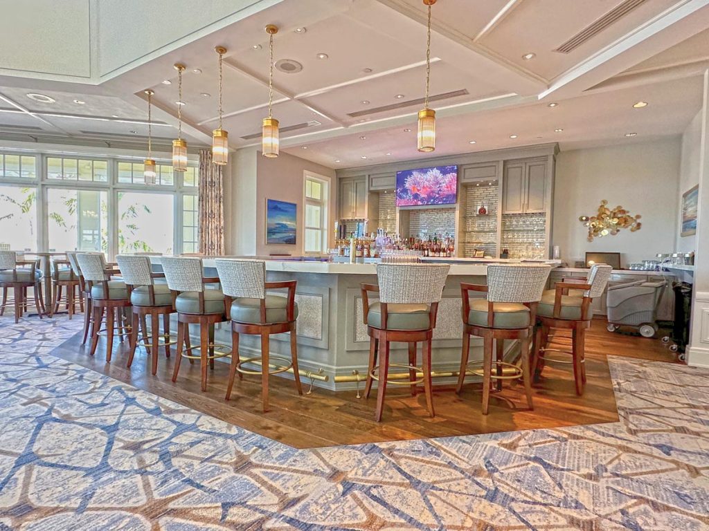Coastal-inspired interior dining space at The Moorings Club