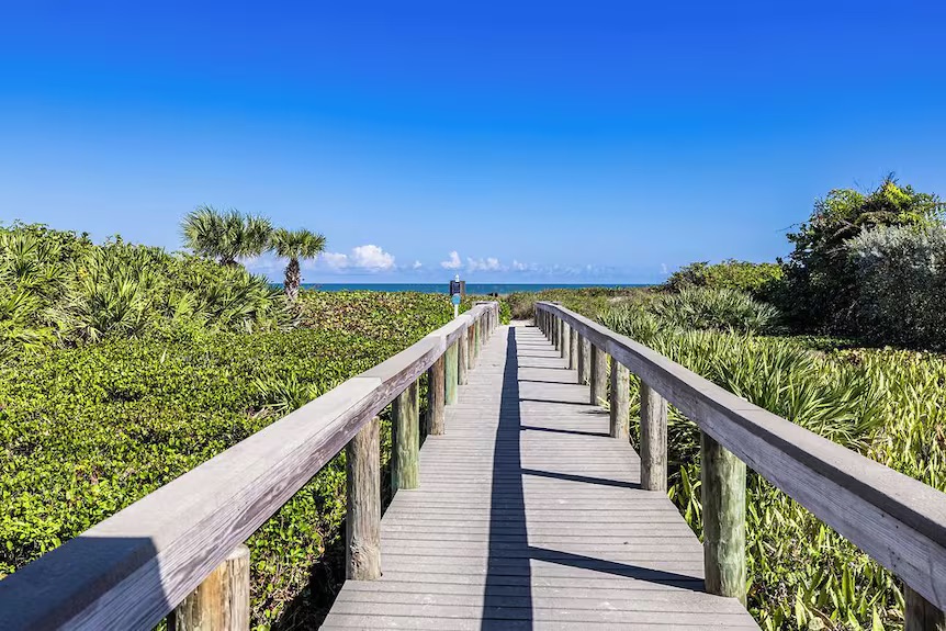 Private beach-access boardwalk within Castaway Cove
