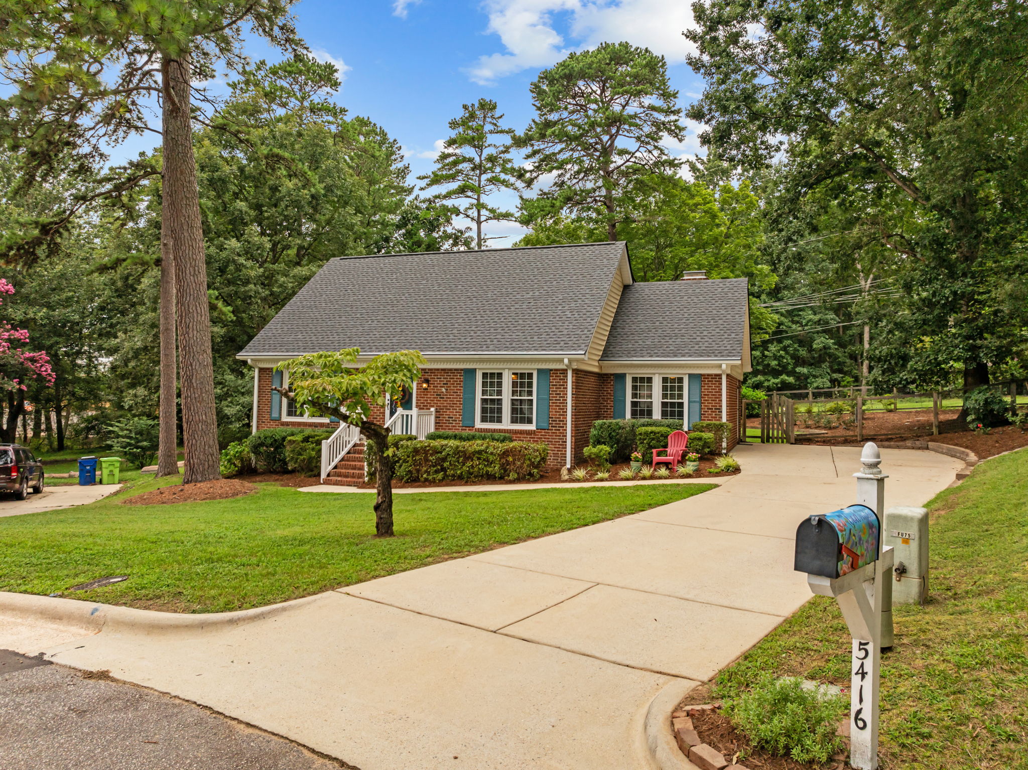 You will fall in love with this green thumb's paradise on more than half an acre and backing up to Cedar Hills Park. A wonderful combination of charm and location, this home sits less than three miles to North Hills, less than eight miles to Downtown Raleigh, and is perfectly positioned between I-440 and I-540. The exterior and interior both offer character that many new builds don't match. The first floor features a centrally located kitchen, a primary bedroom, two living spaces, a formal dining room, and a cozy eat-in breakfast nook. Upstairs, there are two spacious guest bedrooms, a full bath, and even a creative workspace in the unfinished attic, perfect for hobbies and crafts. Step out back and enjoy your own private garden retreat. A natural stone border surrounds dogwoods, azaleas, hydrangeas, roses, gardenias, lilacs, and more, a wonderful canvas for expert and novice gardeners alike. The backyard is fully fenced with a storage shed and a gate that opens directly to Cedar Hills Park. Roof replaced in 2024. Come and see this one for yourself!