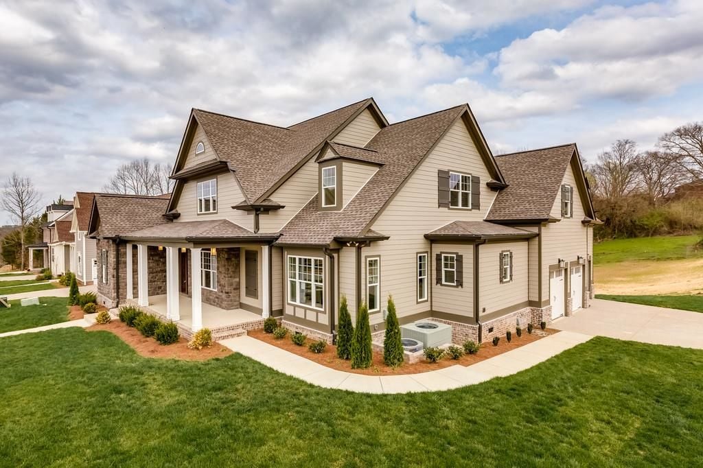 Aerial angle exterior view of a home in Ladd Park neighborhood, Franklin TN 37064, showing surrounding homes and streetscape