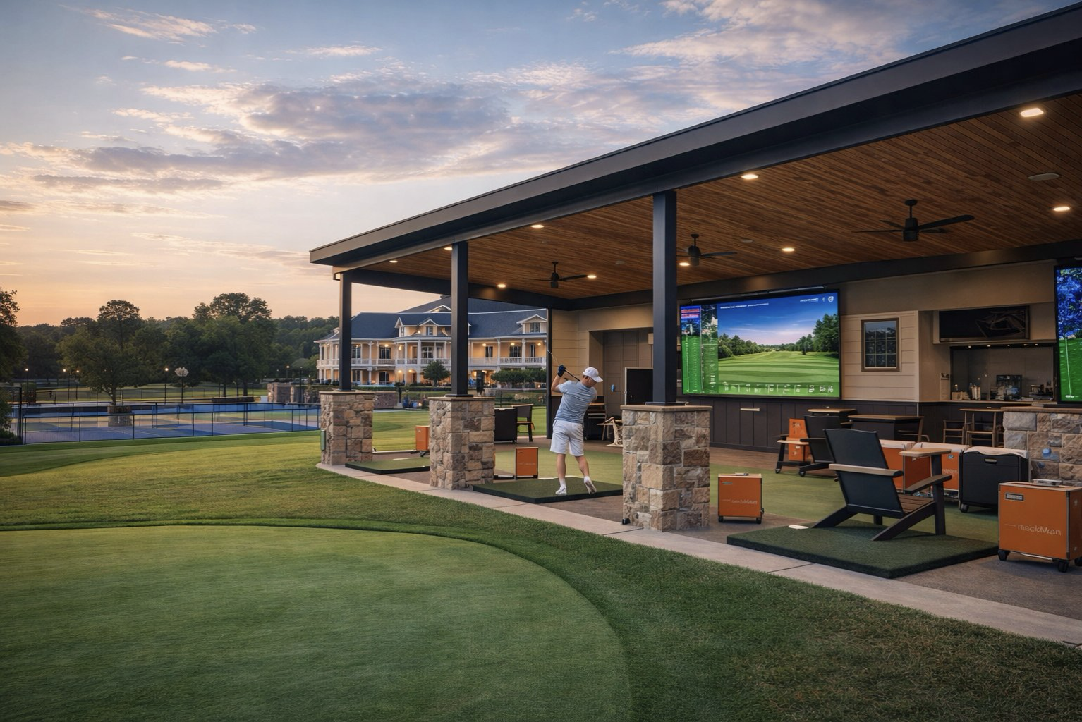 Golf performance center with TrackMan technology at Grasslands Club in Gallatin TN at golden hour, with the renovated clubhouse visible in the background