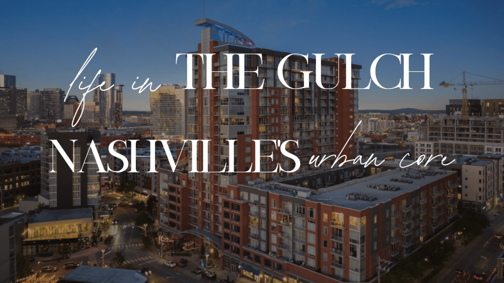 Aerial dusk view of The Gulch high-rise condo building in Nashville TN with Downtown skyline in the background