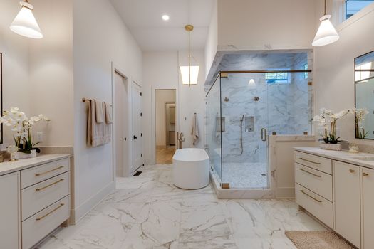 Primary bathroom with marble floors and freestanding tub at 720 Adkisson Ln, Nashville 37205