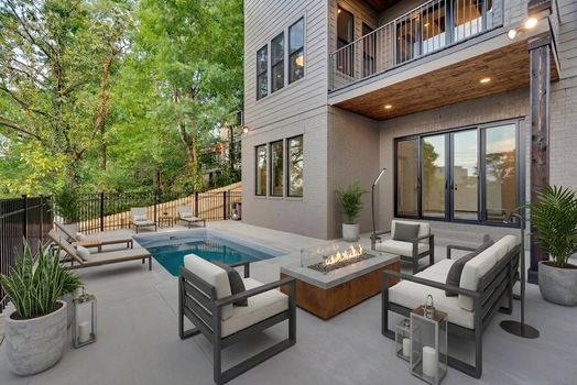 Heated in-ground pool and covered patio with gas fire table at 3304 Love Cir, a new construction home in West End Nashville TN 37212