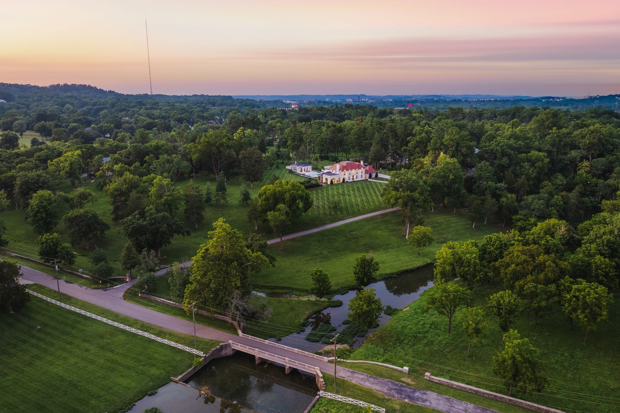 Golden-hour light over the parkland and Richland Creek at 4753 Post Road, Hillwood Nashville