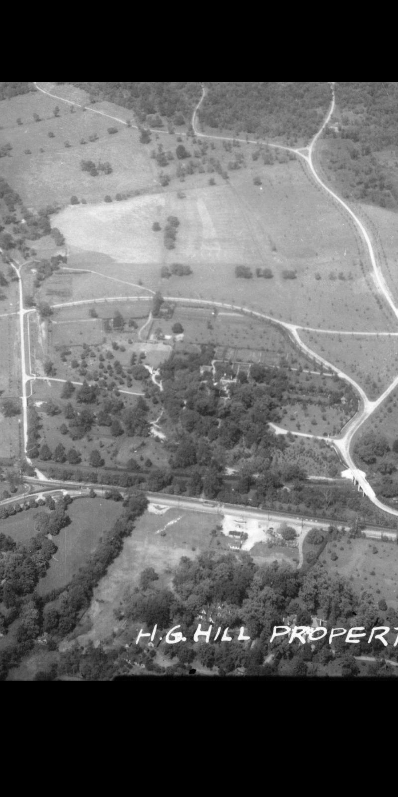 Aerial survey of the H.G. Hill property showing the residential complex and surrounding estate, late 1930s