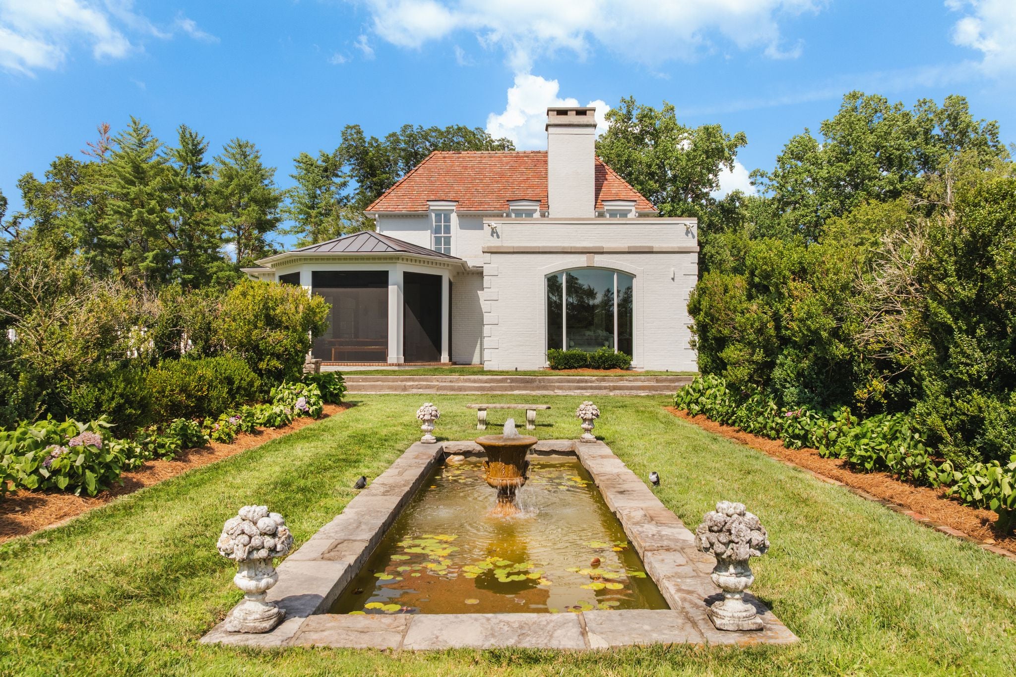 Restored reflecting-pool fountain flanked by statues at 4753 Post Road, Hillwood Nashville