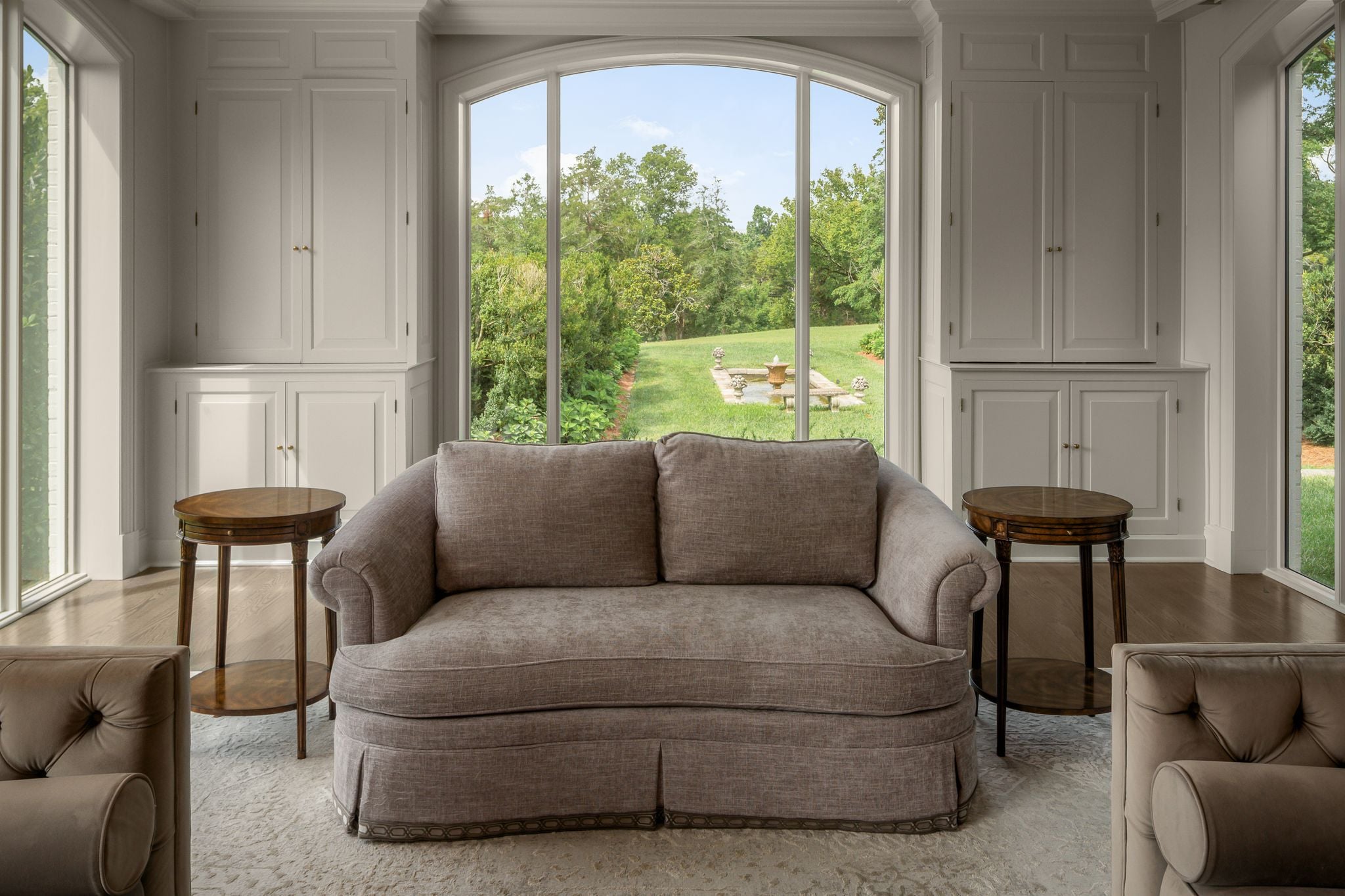 The sunroom with floor-to-ceiling arched windows and parkland views at 4753 Post Road, Hillwood Nashville