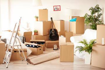 Living room filled with moving boxes after relocating to Tennessee