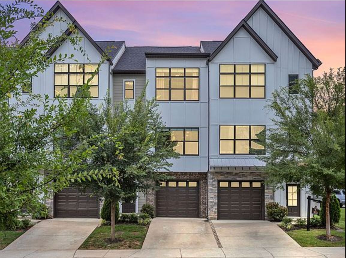 Exterior of the three-story 204 Stonecrest Circle townhomes in Bellevue, Nashville at dusk