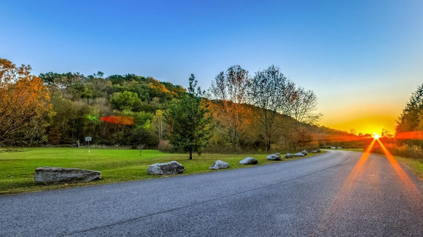 Autumn sunset over a park road and open field in Bellevue, Nashville near Warner Parks