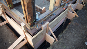 Residential foundation reinforcement in progress, showing wood framing and bolts in a St. Augustine FL property.