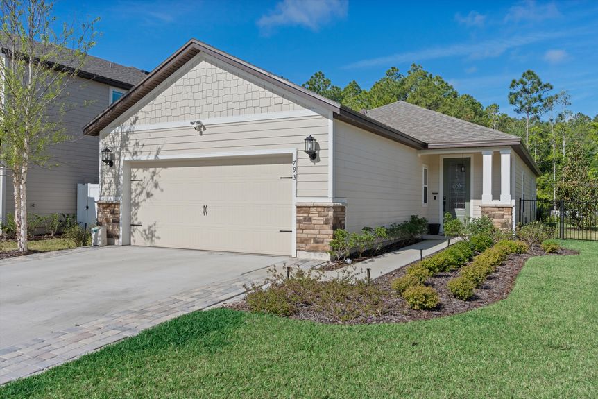 Close-up of the home's front exterior, showcasing its architectural details and inviting entrance.