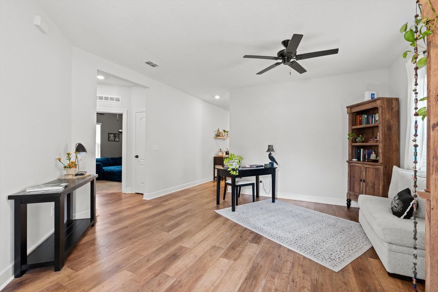 Bright foyer area with an adjacent home office space.