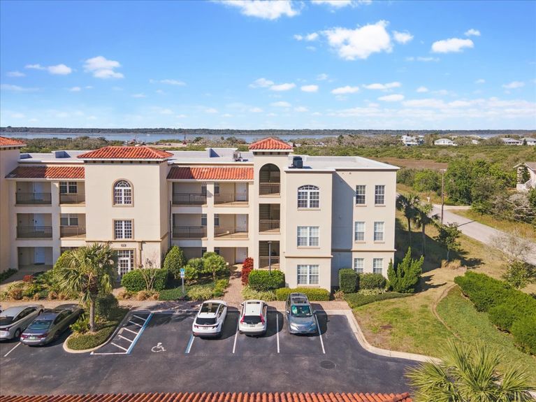 Third-floor corner-unit balcony at The Estuaries in St. Augustine, FL, overlooking pristine marshland.