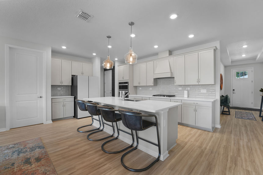 Gourmet chef’s kitchen featuring a large island, stainless steel appliances, and custom cabinetry at 50 Skyline Lane.