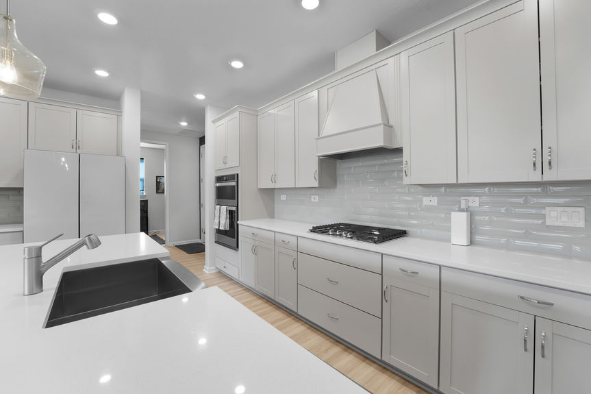 Gourmet chef’s kitchen featuring a large island, stainless steel appliances, and custom cabinetry at 50 Skyline Lane.