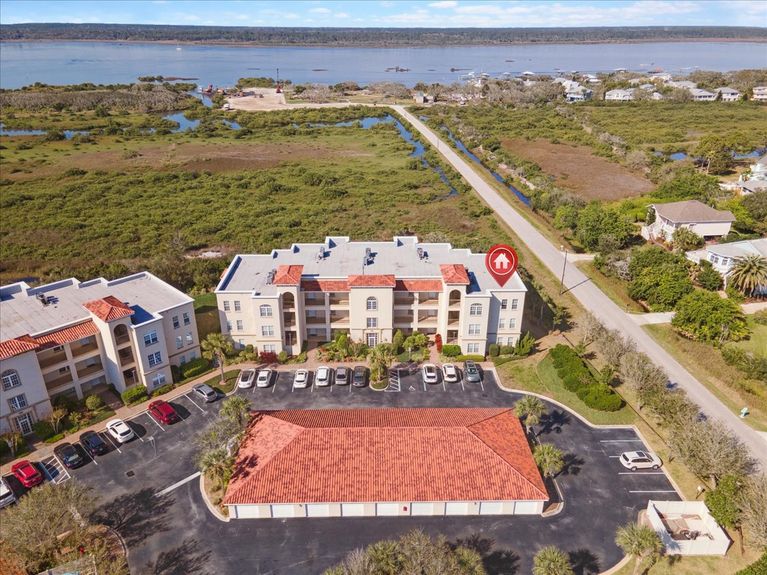 Third-floor corner-unit balcony at The Estuaries in St. Augustine, FL, overlooking pristine marshland.