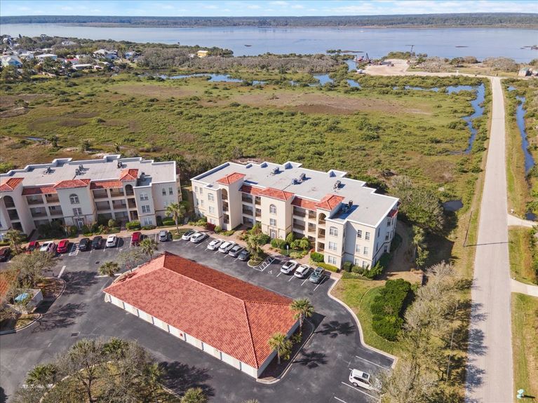 Third-floor corner-unit balcony at The Estuaries in St. Augustine, FL, overlooking pristine marshland.