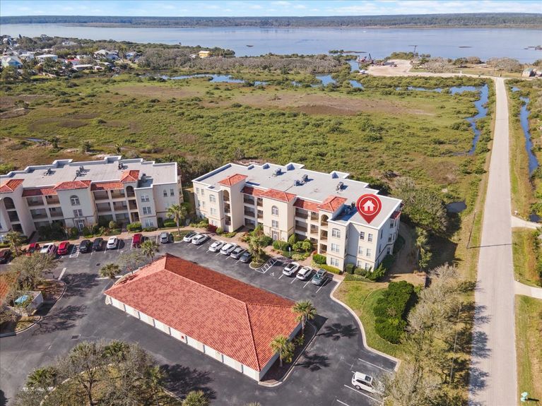 Third-floor corner-unit balcony at The Estuaries in St. Augustine, FL, overlooking pristine marshland.