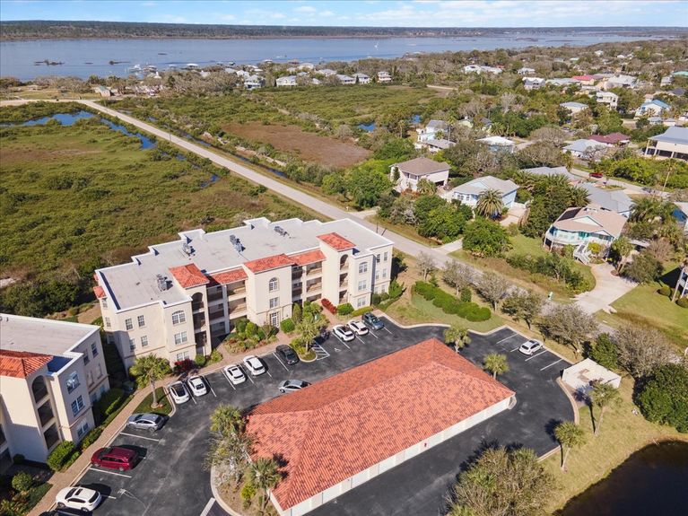 Third-floor corner-unit balcony at The Estuaries in St. Augustine, FL, overlooking pristine marshland.
