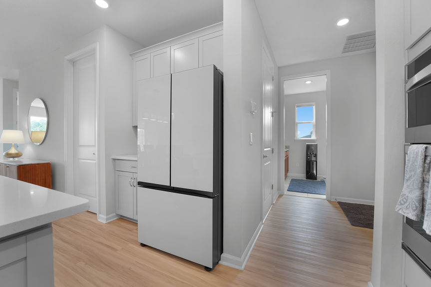 Gourmet chef’s kitchen featuring a large island, stainless steel appliances, and custom cabinetry at 50 Skyline Lane.