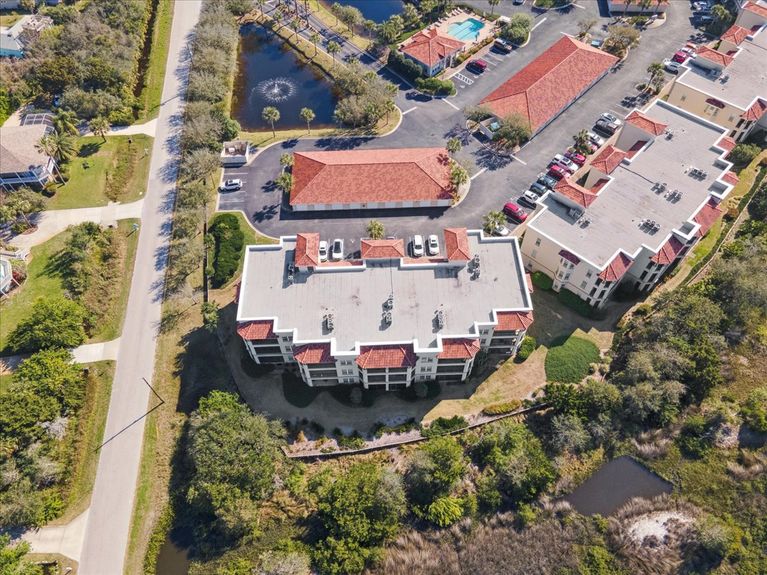 Third-floor corner-unit balcony at The Estuaries in St. Augustine, FL, overlooking pristine marshland.