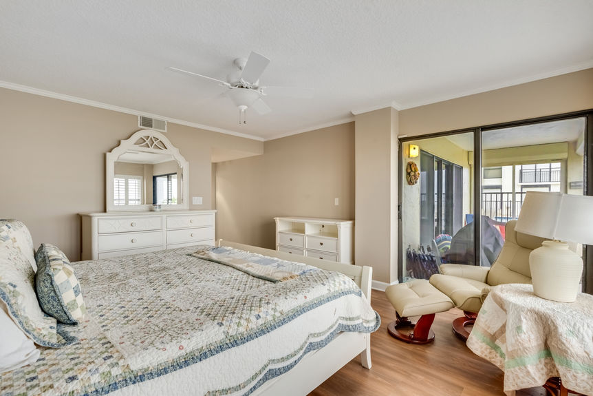 Primary Bedroom – Elegant primary suite with a king-size bed, private balcony access, and breathtaking ocean views.