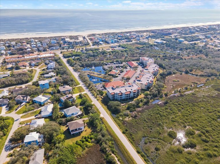Nestled in the gated community of The Estuaries, this third-floor, corner-unit residence offers breathtaking Intracoastal marsh views.