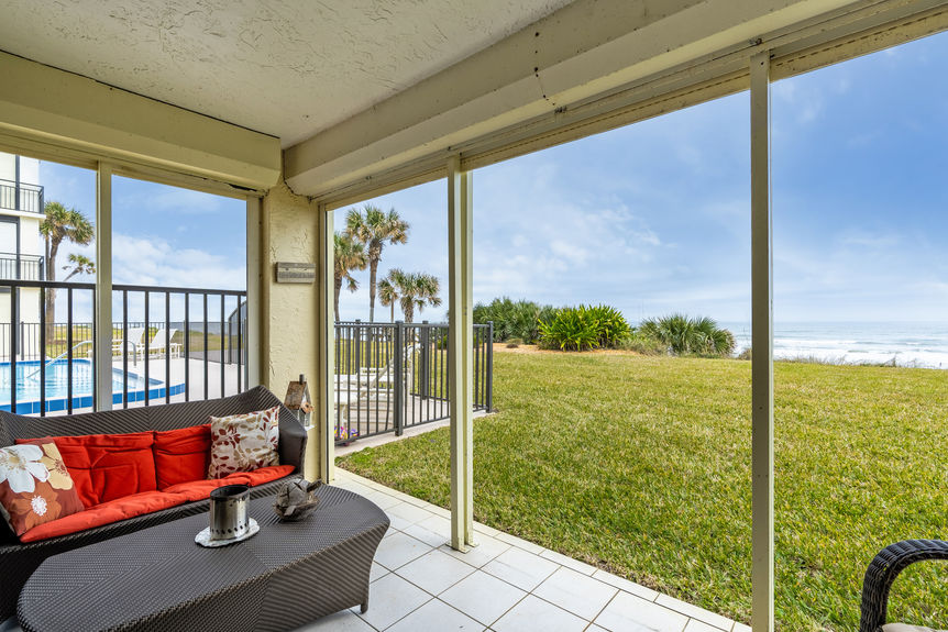 Covered Patio View – Private covered patio with direct views of the Atlantic Ocean and white sandy beaches.