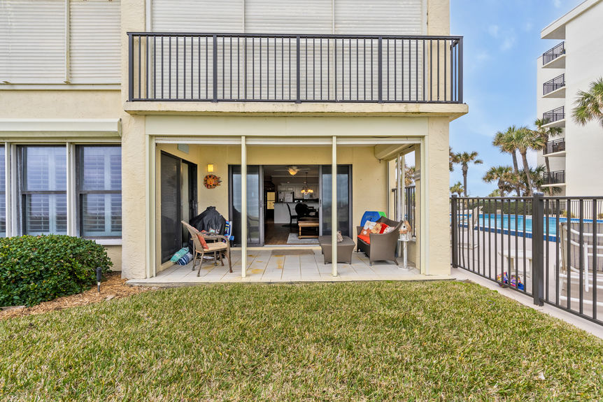 Covered Patio View – Private covered patio with direct views of the Atlantic Ocean and white sandy beaches.