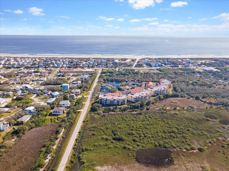 Sandy path leading to Mary Street Beach Access, just across the street from The Estuaries condo community.