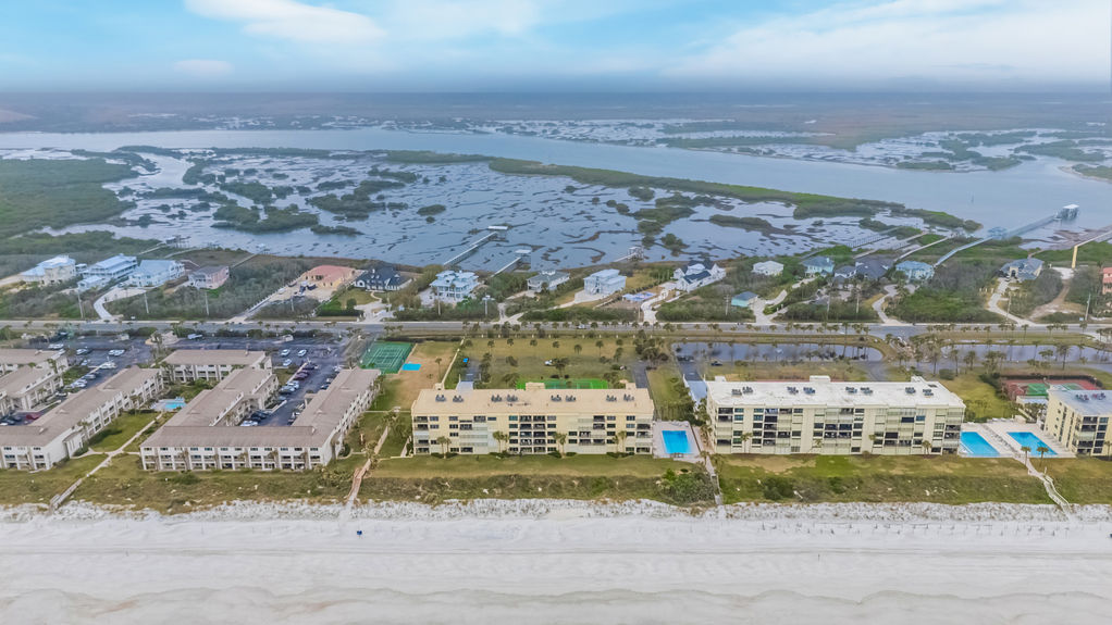 Aerial View – Aerial shot showcasing the Sand Dollar Community and its prime oceanfront location.