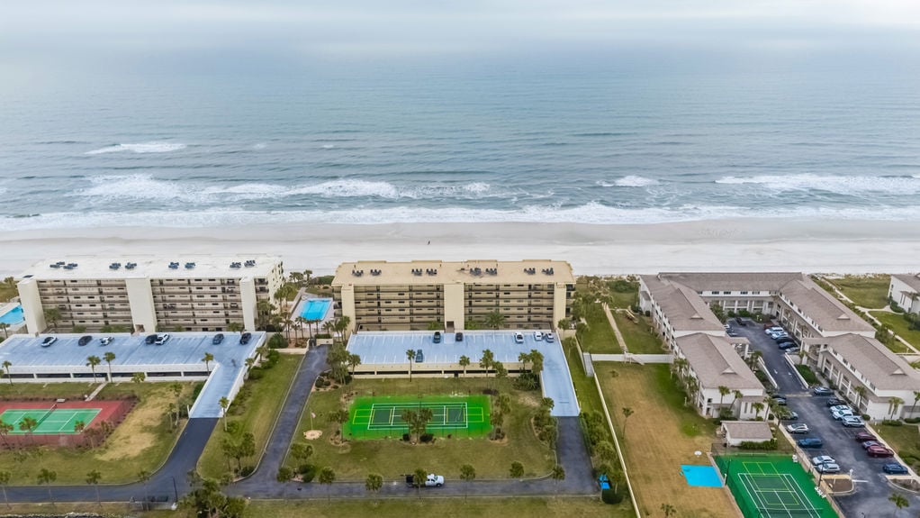 Aerial View – Aerial shot showcasing the Sand Dollar Community and its prime oceanfront location.