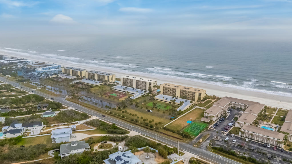 Aerial View – Aerial shot showcasing the Sand Dollar Community and its prime oceanfront location.