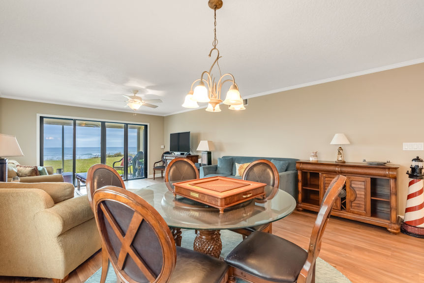 Kitchen & Dining Area – Bright kitchen with lots of counter space, large area for barstool seating, and a dining area overlooking the ocean.