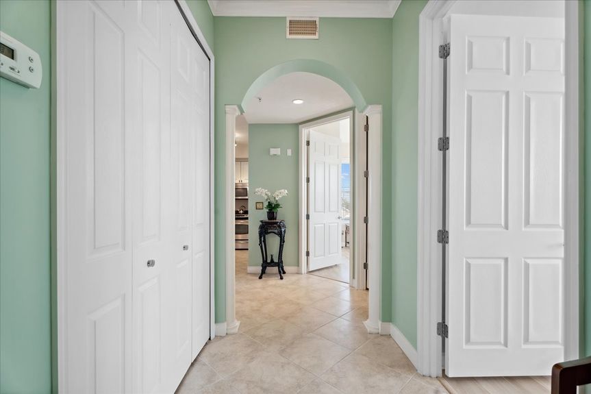 Bright and welcoming entryway in a St. Augustine condo, featuring stylish flooring and natural light.