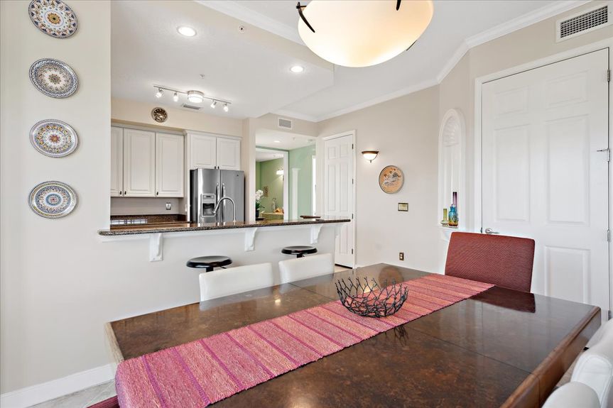 Spacious dining area in a St. Augustine condo, featuring natural light and an open-concept design.