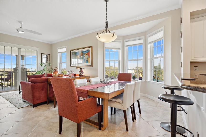 Spacious dining area in a St. Augustine condo, featuring natural light and an open-concept design.