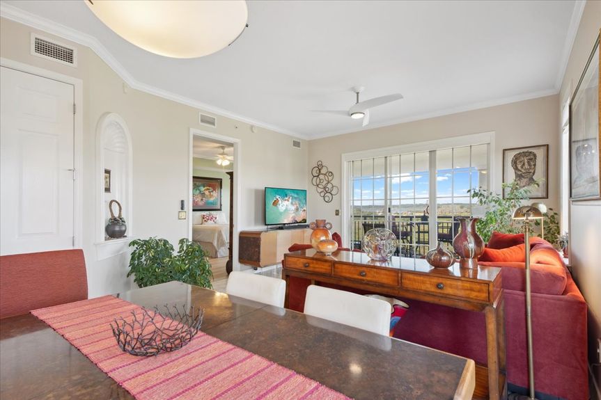 Open-concept living room in a St. Augustine condo, featuring natural light and panoramic marsh views.