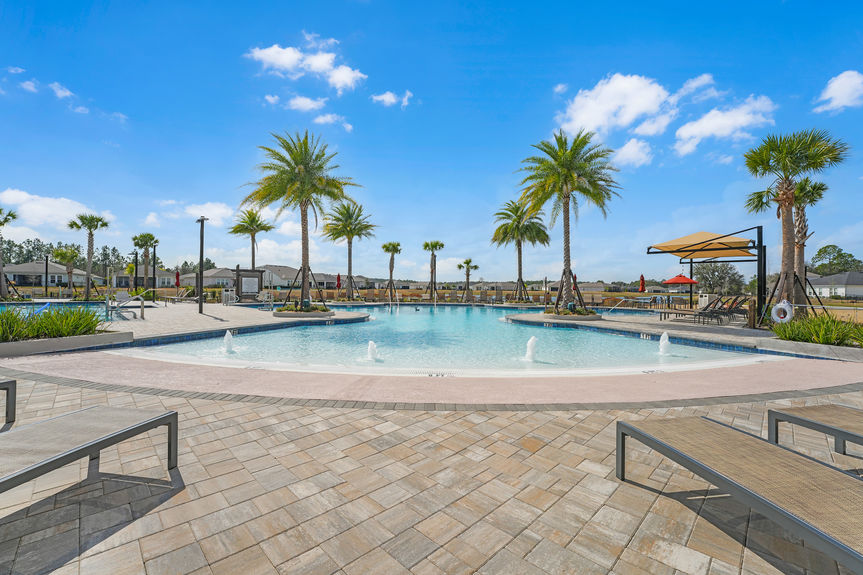 Luxurious 55+ community amenities, including a pool, clubhouse, and walking trails at Reverie at Trailmark in St. Augustine.
